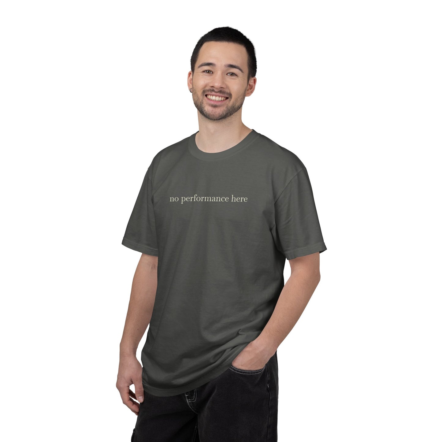 Man wearing a gray t-shirt with 'no performance here' text on a white background