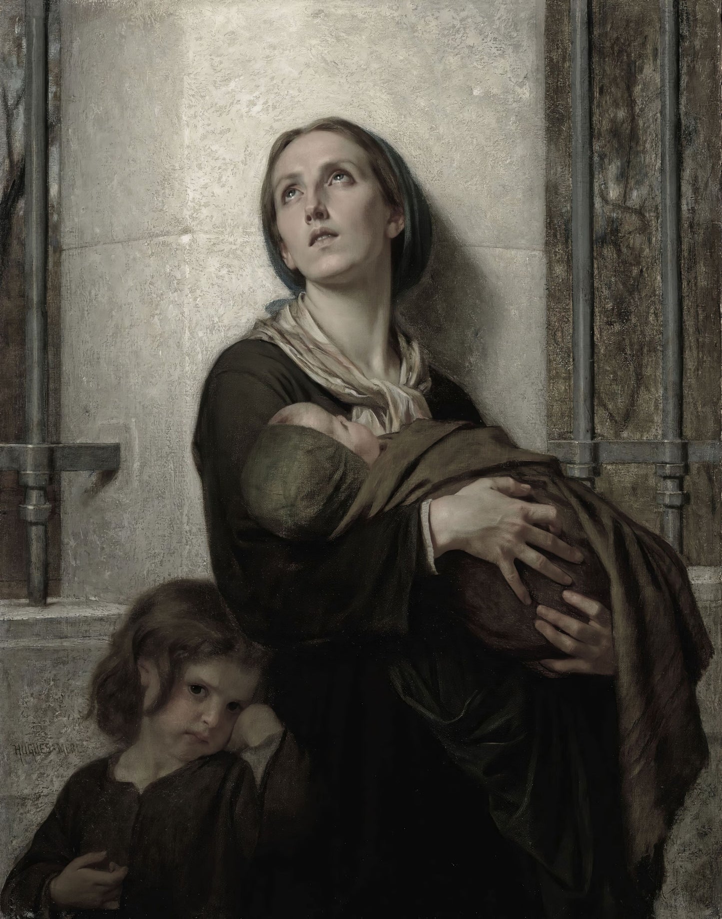 Woman holding a child in a dimly lit room with stone walls.