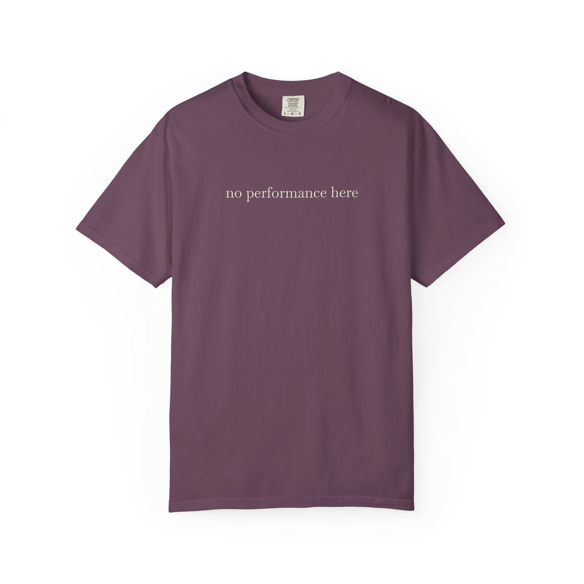 Purple t-shirt with 'no performance here' text on a white background