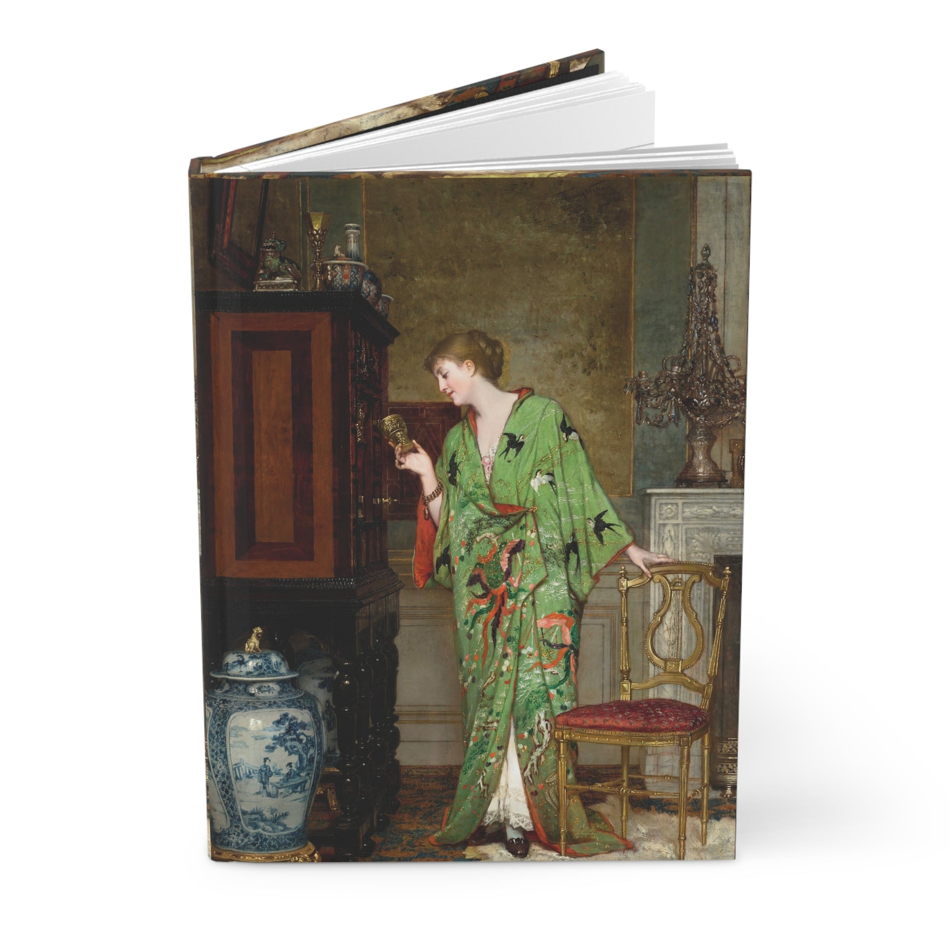 Notebook with a painting of a woman in a green dress on the cover