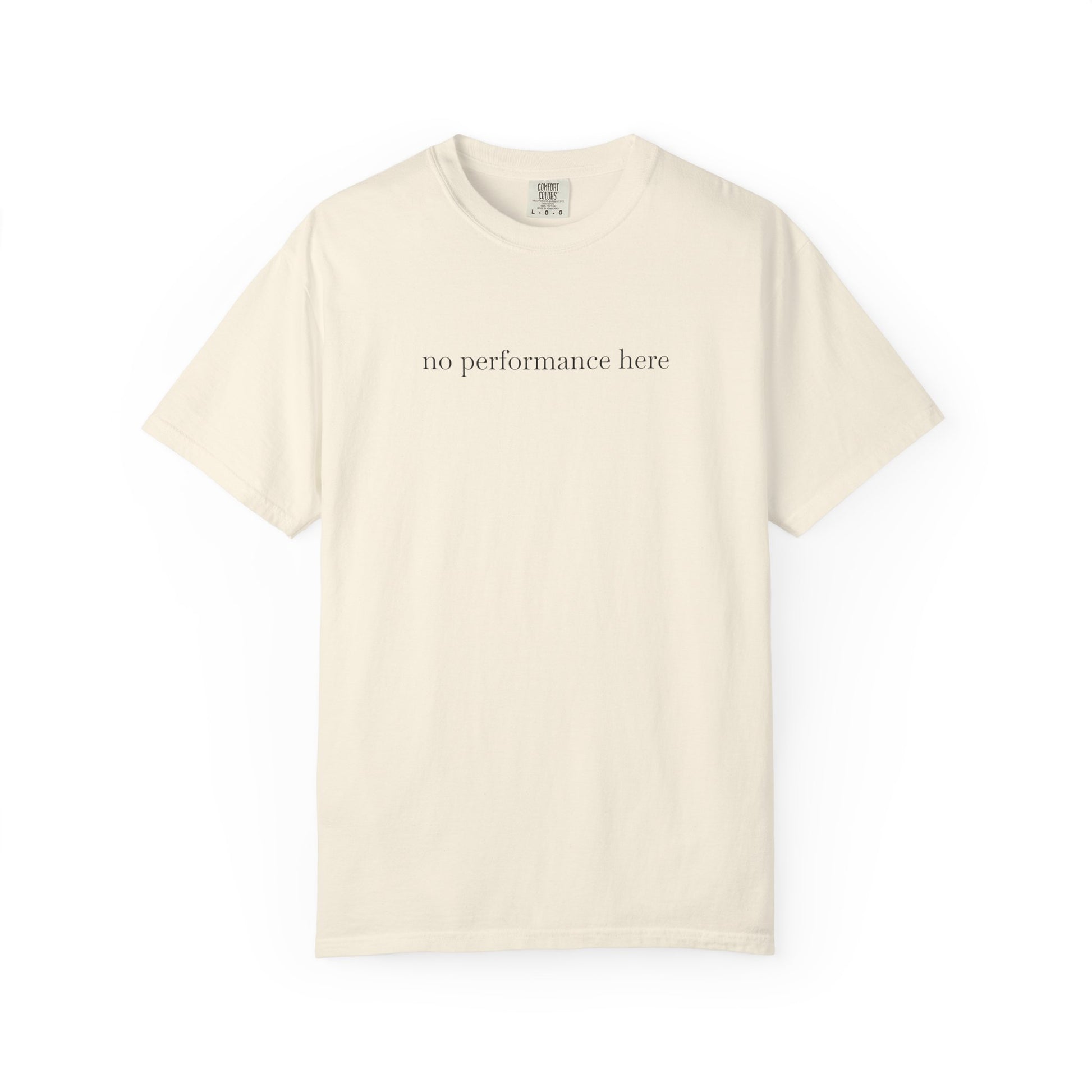 Beige t-shirt with 'no performance here' text on a white background