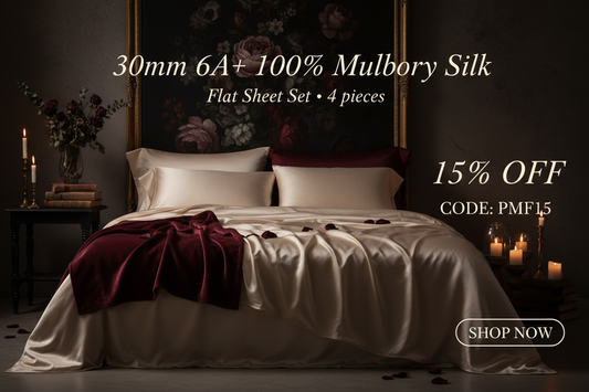 Moody bedroom with champagne mulberry silk bedding and dark floral wall art