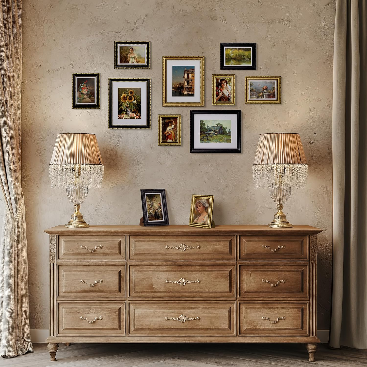 Wooden dresser with two lamps and framed pictures on a beige wall.